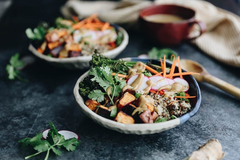 These customizable Quinoa Veggie Bowls with Miso Sesame Dressing will become a weeknight staple. With a quinoa and veggie base topped with a zesty and flavor-packed dressing this easy dinner or lunch recipe is a healthy vegan option for the whole family.