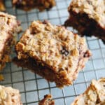 oatmeal breakfast bars on a wire rack with chocolate chips.