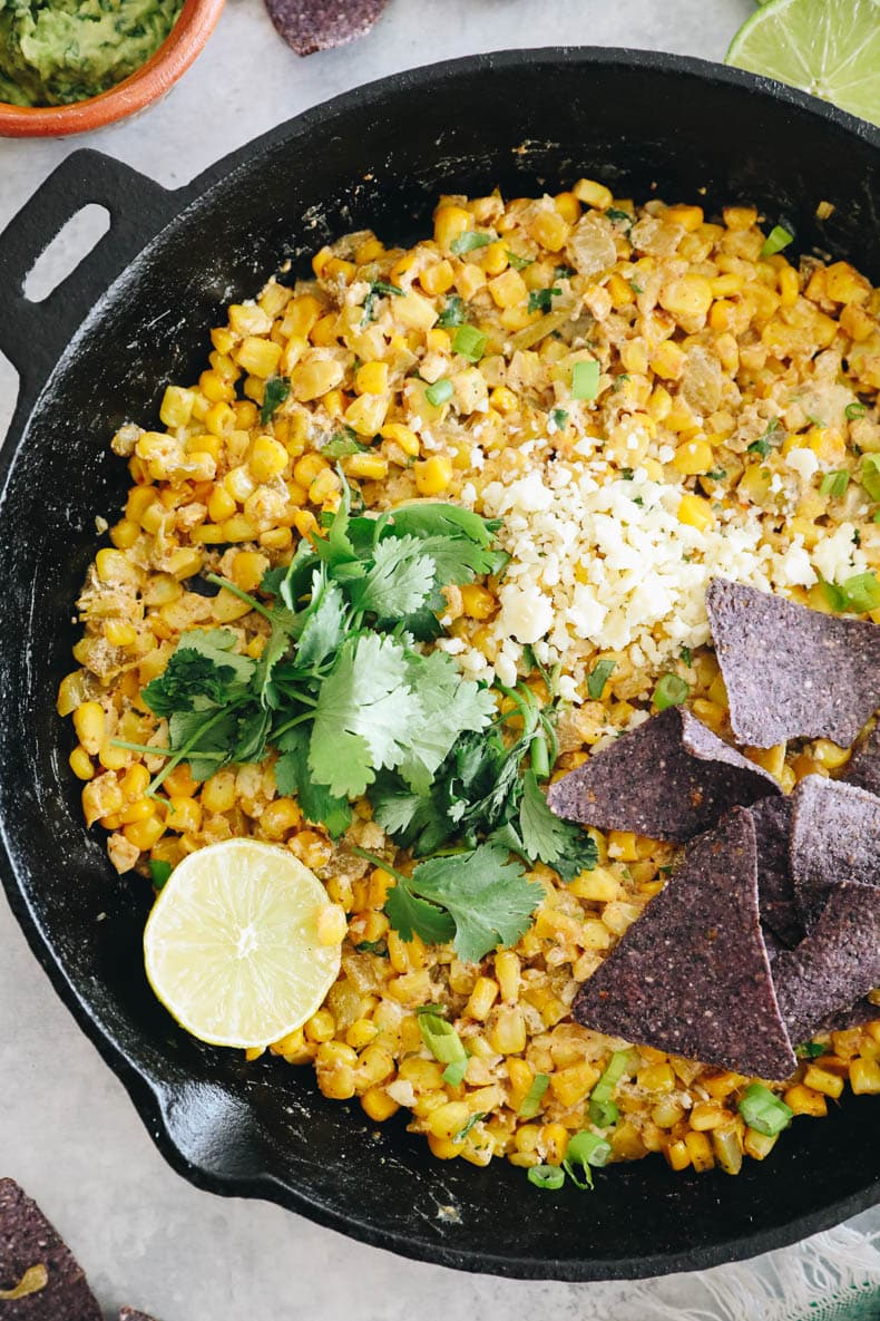 overhead of Mexican street corn salad in a cast iron skillet.