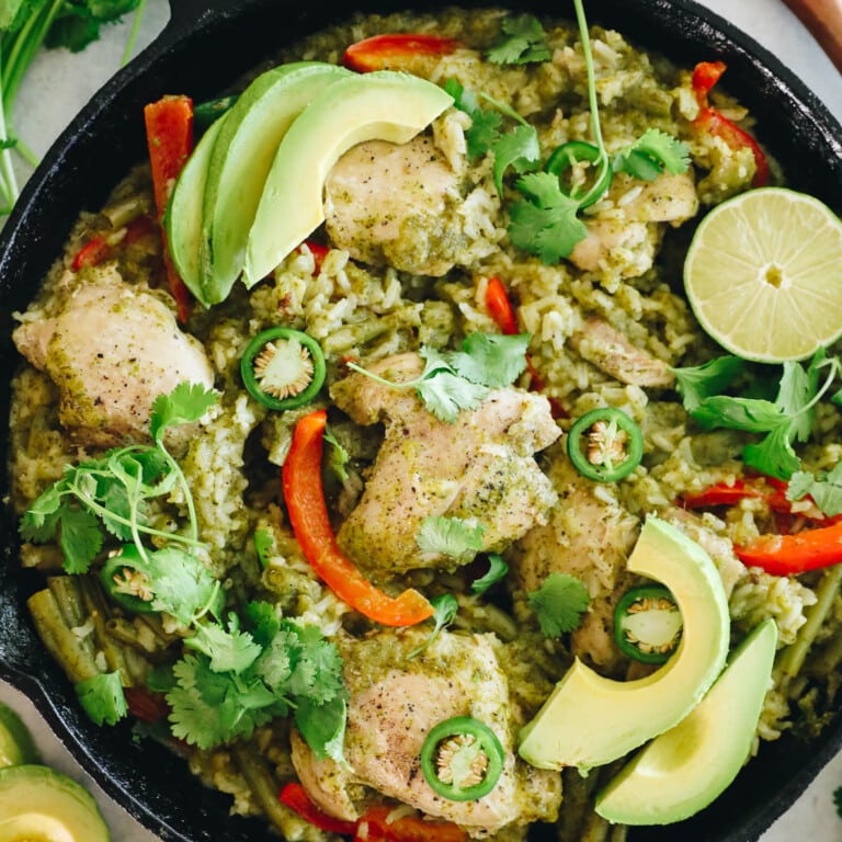 chicken thighs, cilantro, lime and rice in a cast iron.