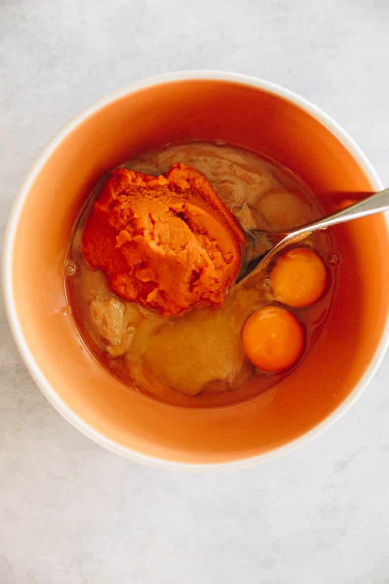 eggs, pumpkin and cashew butter in a mixing bowl.