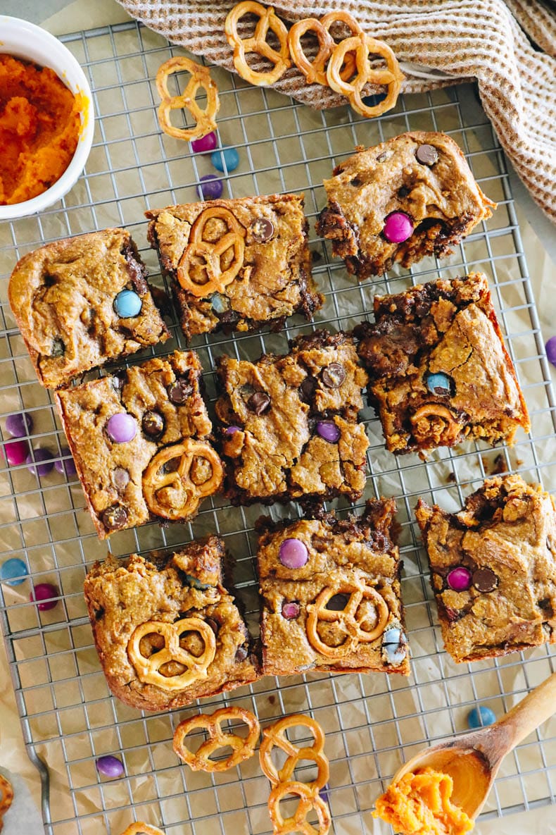 pumpkin monster cookie bars on a wire rack.