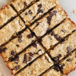 Baked and sliced high protein granola bars on parchment paper