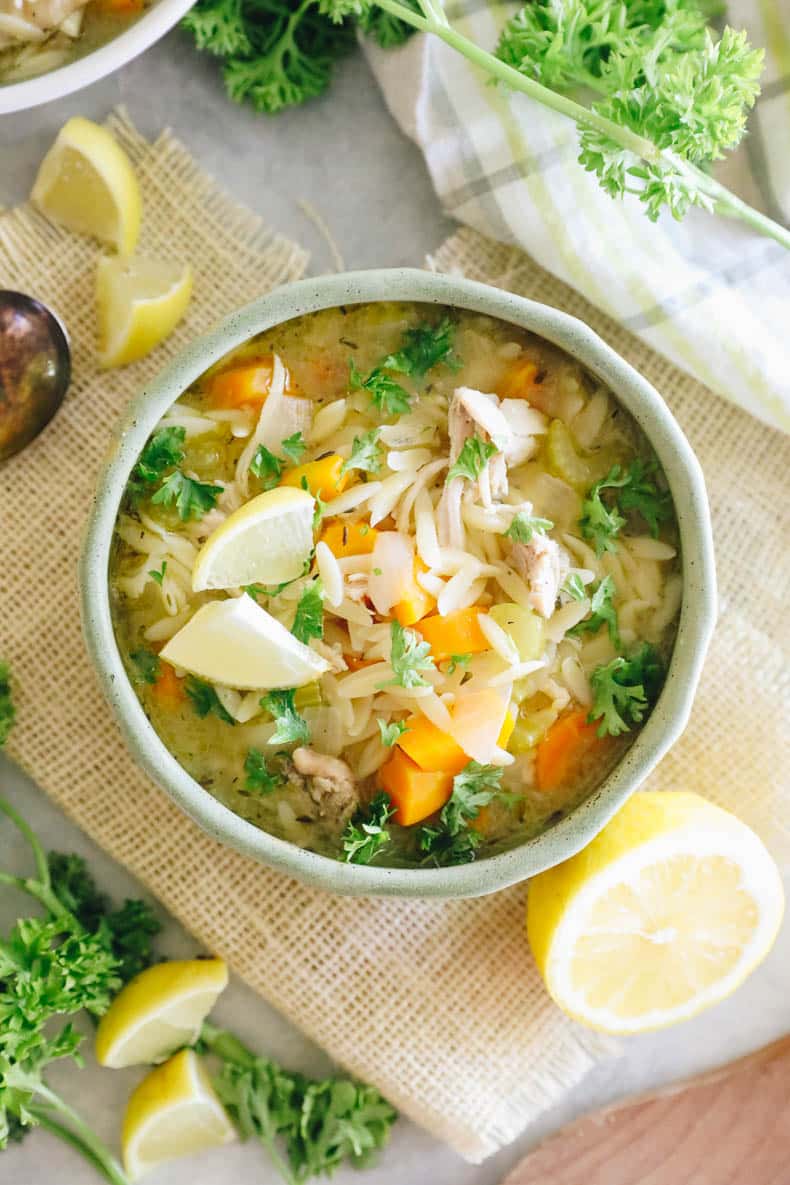 Lemon Chicken Orzo Soup in a green bowl.