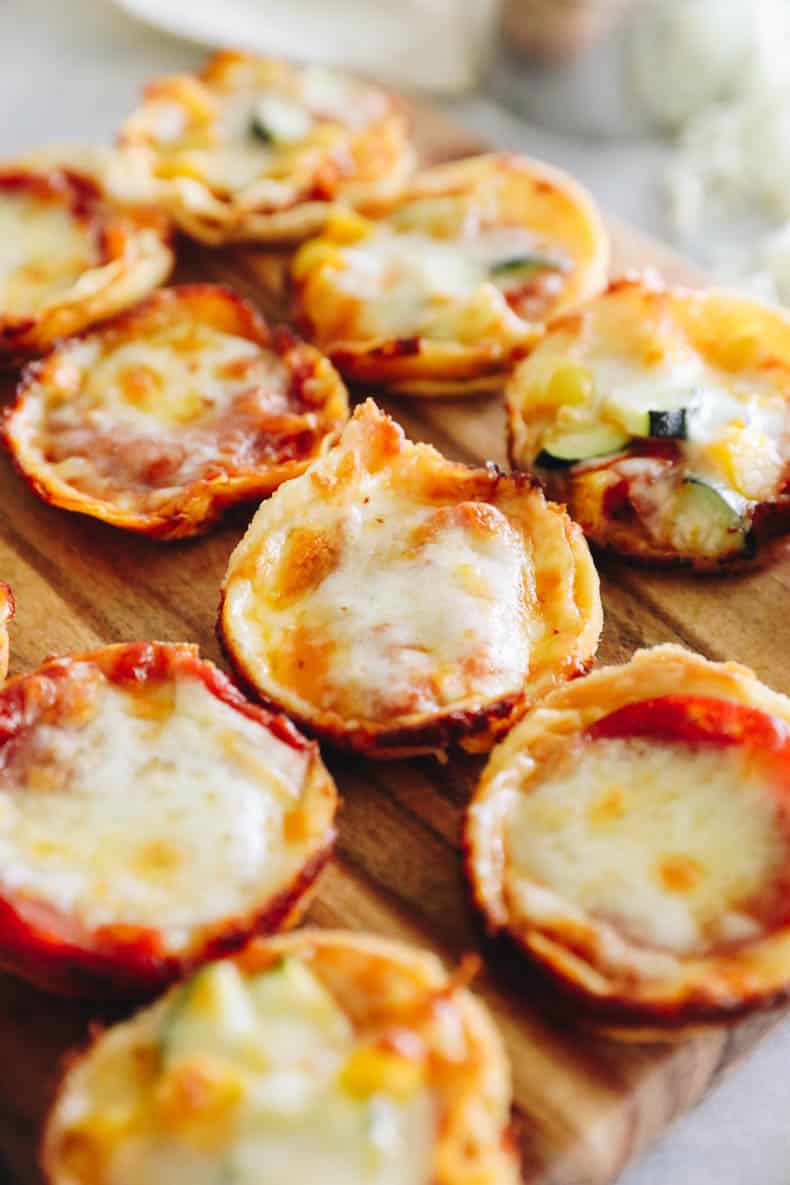 mini tortilla pizza cups on a cutting board