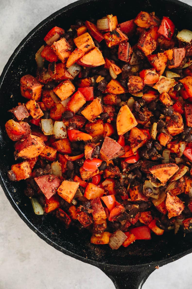 Sweet potato and black bean mixture in a cast iron skillet