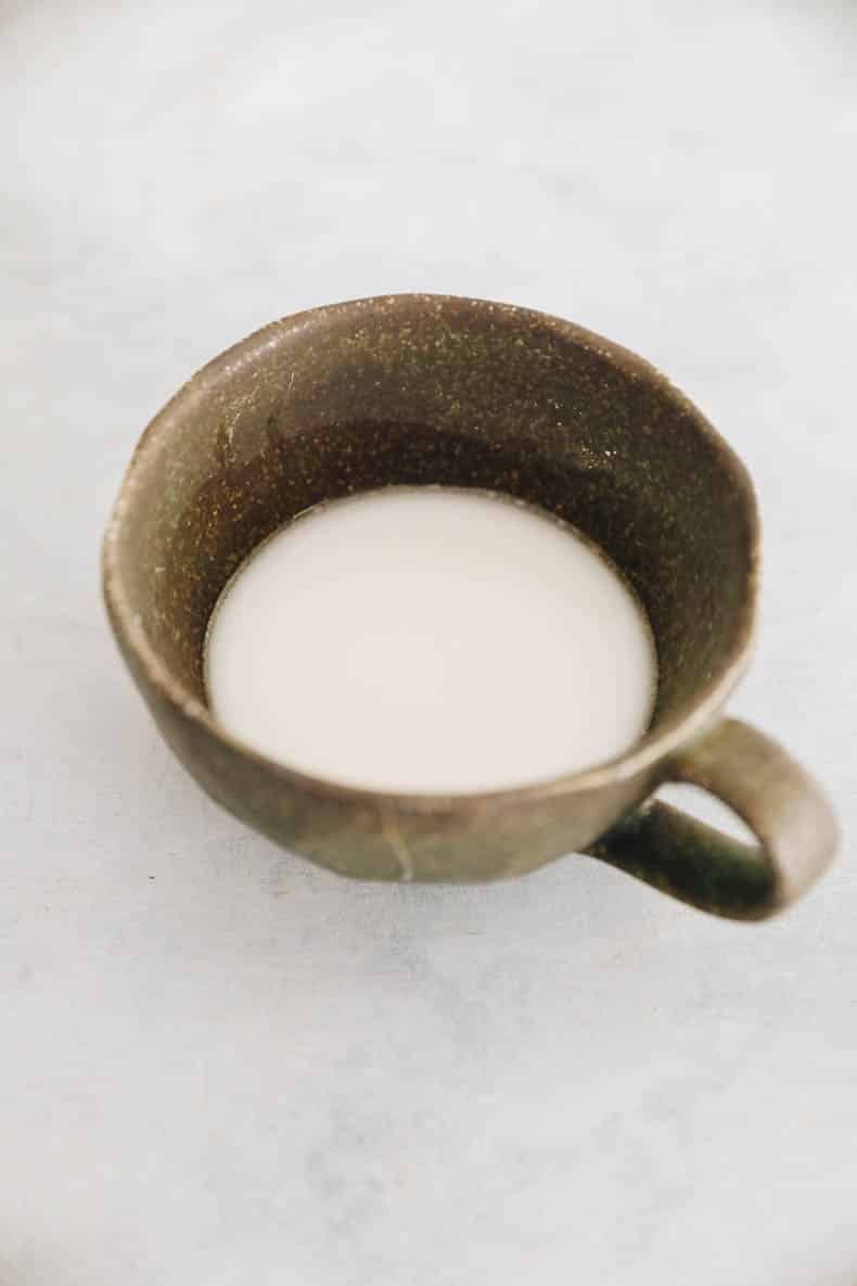 tapioca starch slurry in a brown cup.