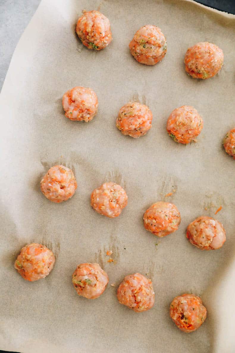 raw chicken meatballs rolled into balls.