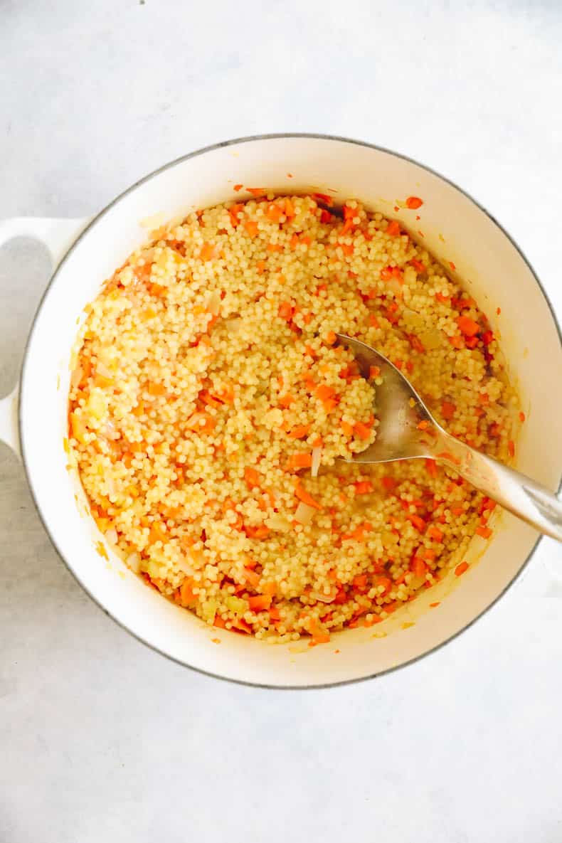 pastina soup in a large white dutch oven.