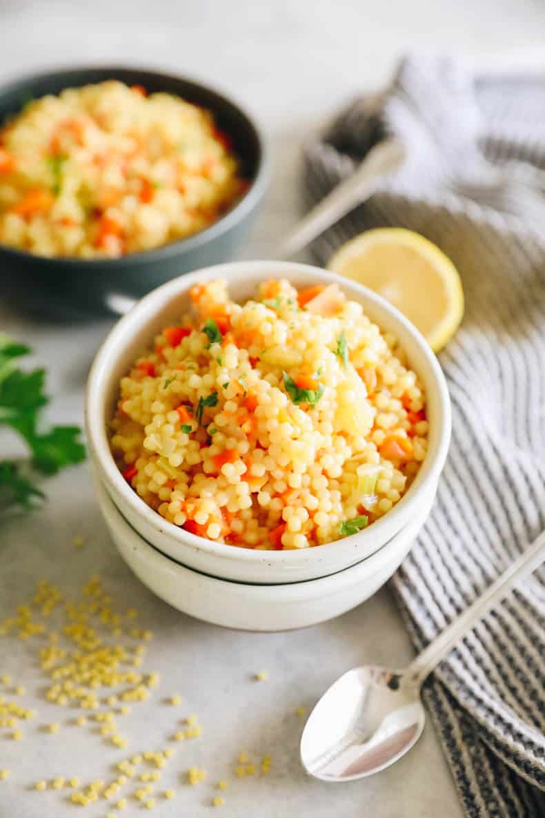 pastina soup with carrots, celery and onion and topped with parmesan, lemon and parsley.