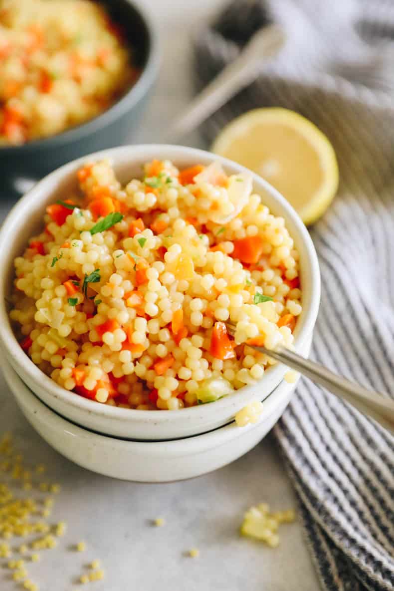 Pastina soup in a white bowl.