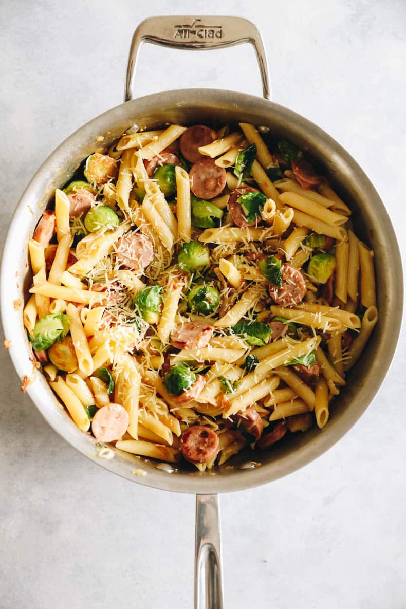 Chicken sausage noodles are cooked in a large pot