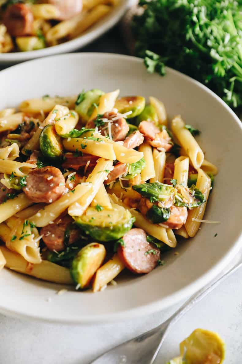 Chicken sausage noodles, white light bowl.