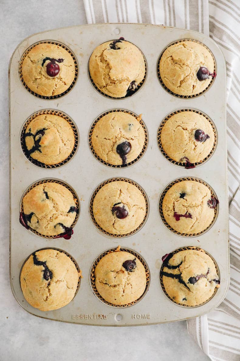 Lemon Blueberry Muffins in a muffin tin.