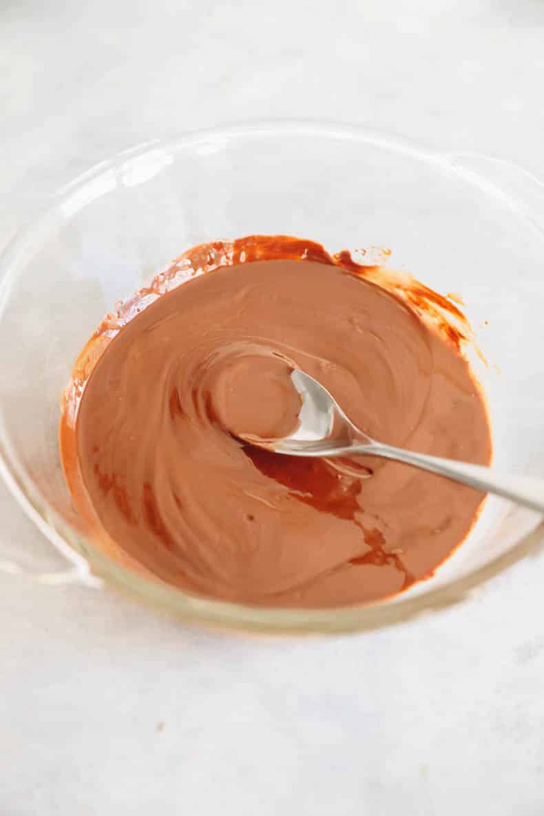 chocolate and coconut oil melted in a glass bowl.