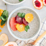 close up image of chia pudding in a blue and white bowl with grapefruit, blood orange and tangelo.