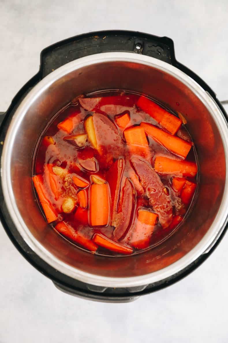 Carrots and potatoes cooked in gravy in an instant pot.