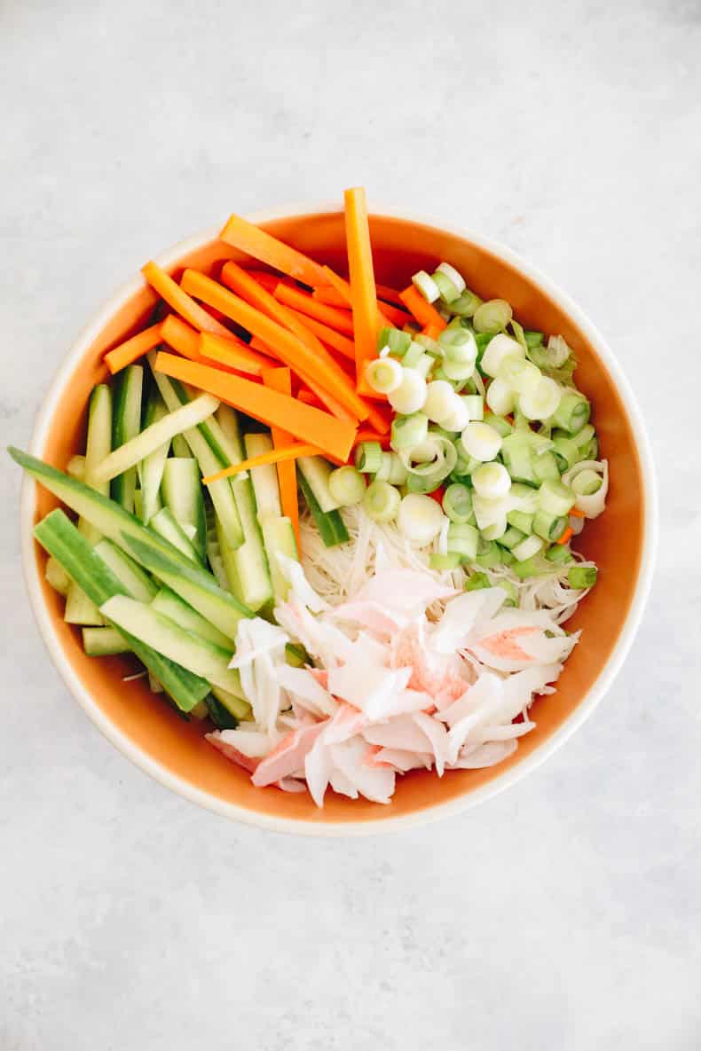 kani salad in an orange bowl.