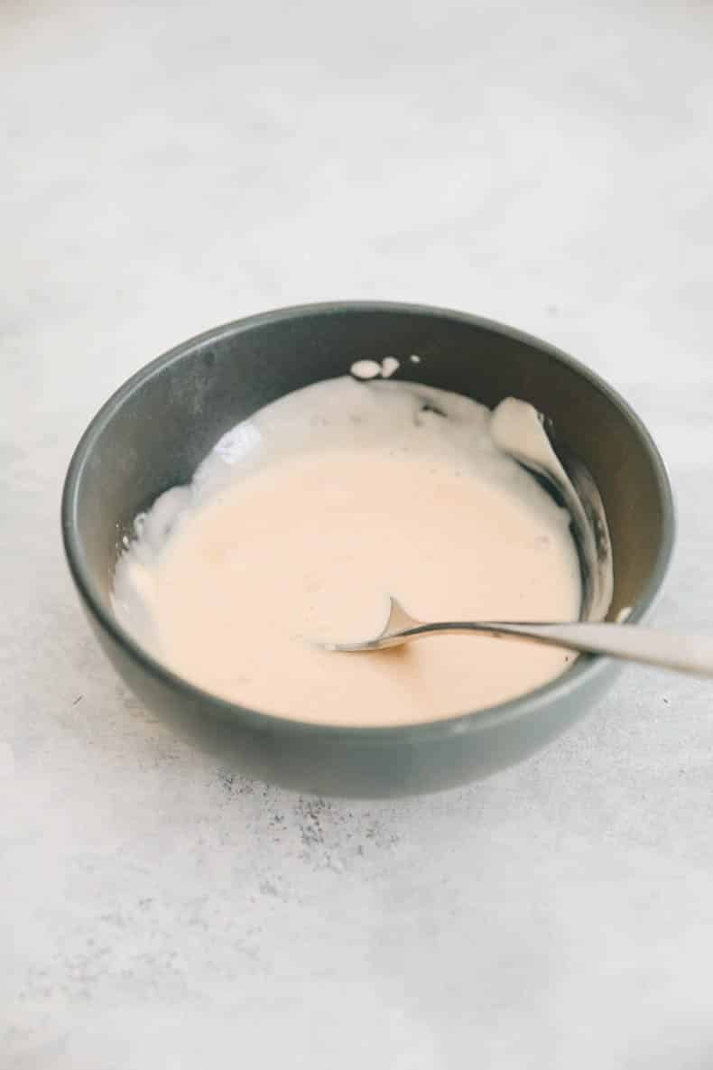 surimi salad dressing in a blue bowl.